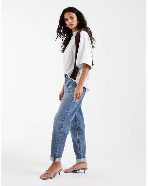 Vaqueros Mom Holgados De Talle Alto De ASOS de color Blue