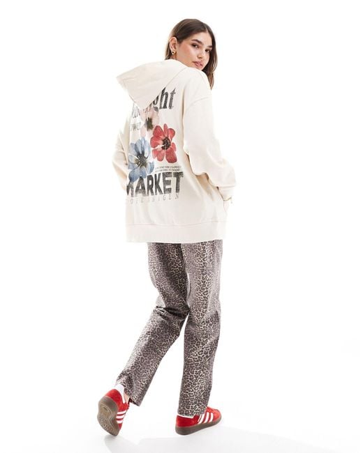 Sudadera color extragrande con capucha y estampado floral y texto "market" ASOS de color White