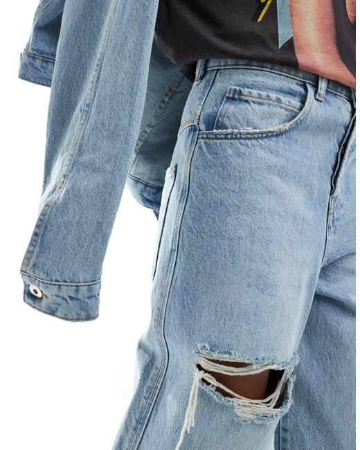 X015 - jeans super baggy a vita bassa lavaggio chiaro con strappi di Collusion in Blue