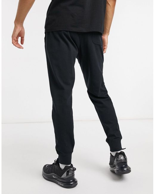 nike club cuffed sweatpants in black