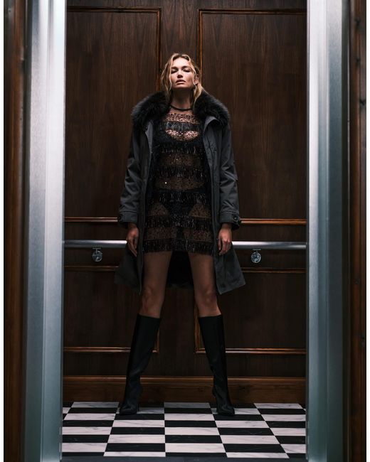 Tana - robe t-shirt courte transparente à rayures ornée Ghospell en coloris Brown