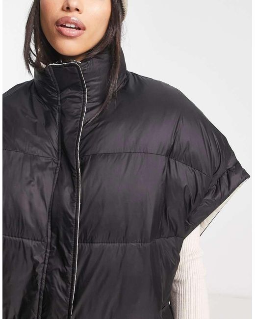Chaleco De Plumas Negro Reversible Sydnee De Ugg de color Black