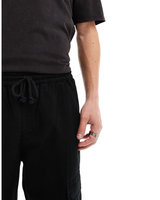 Pantaloni cargo unisex neri di Guess in Black