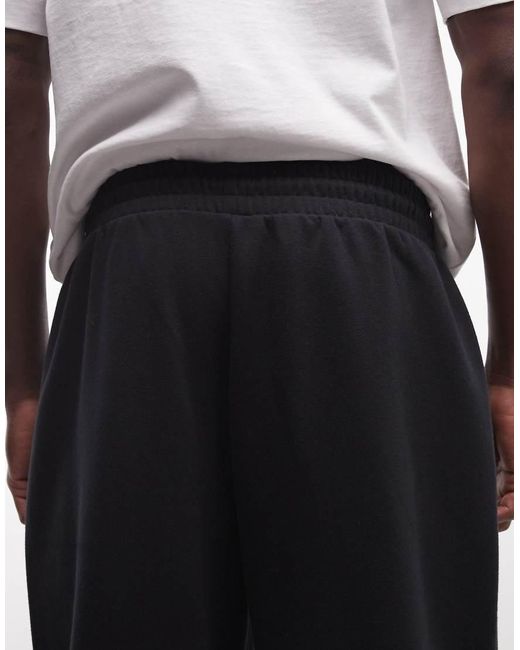 Collusion White Relaxed Sweatpants for men