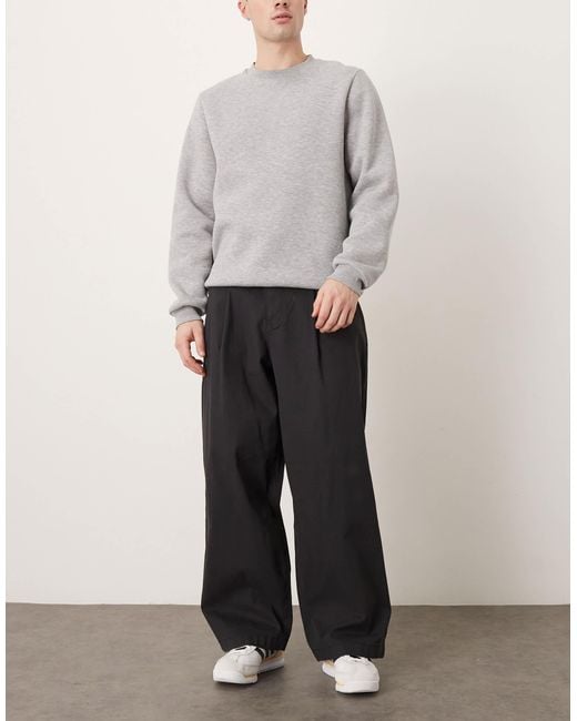 Pantalon oversize coupe baggy à pinces ASOS pour homme en coloris Black