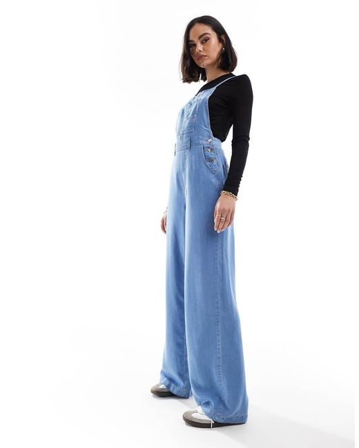 Stradivarius Blue Denim Jumpsuit With Cross Back