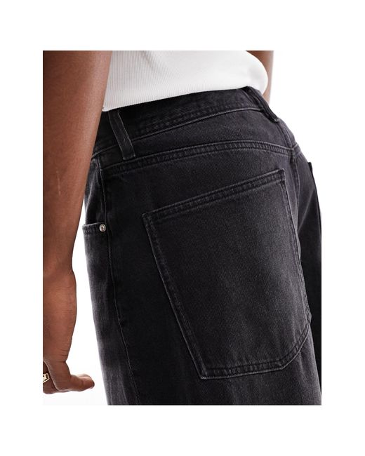 Jeans larghi slavato di ASOS in Black da Uomo