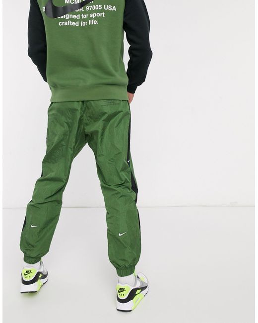Nike Swoosh - Geweven joggingbroek Met Boorden in het Green voor heren