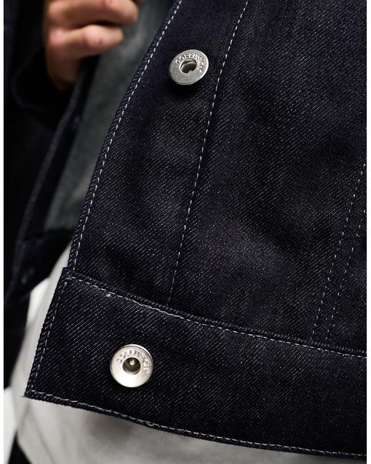 Unisex - giacca di jeans lavaggio grezzo di Collusion in Black