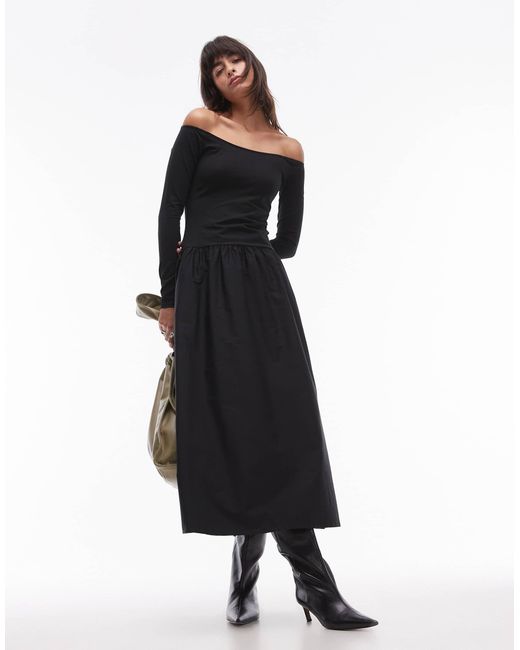 Robe mi-longue avec taille basse et encolure bardot Mango en coloris Black