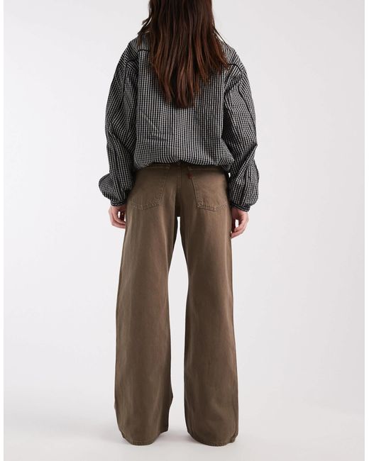 Jean bootcut ample en denim délavé Levi's en coloris Gray