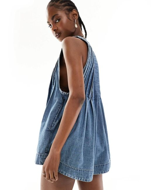 Combishort en jean avec col en v et liens noués à l'avant - délavage moyen Free People en coloris Blue