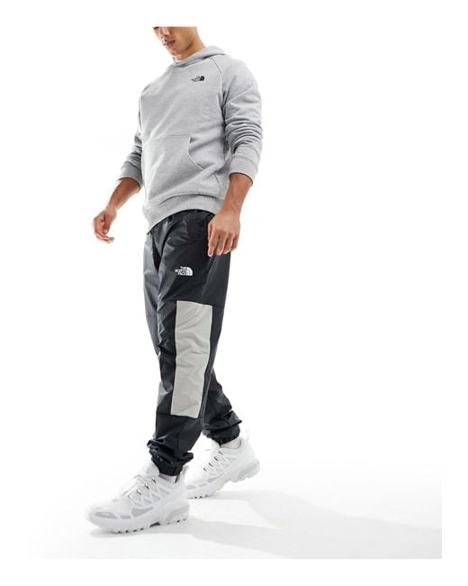 The North Face White Training Mountain Athletics Wind Track joggers for men