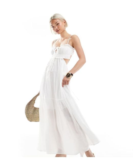 The Frolic White Exclusive Tie Front Ruffle Trim Open Back Tiered Maxi Dress