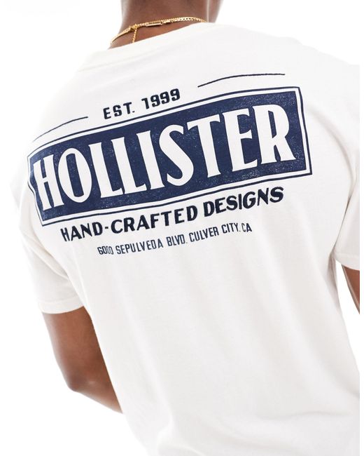 Camiseta color crema con estampado en la espalda Hollister de hombre de color White