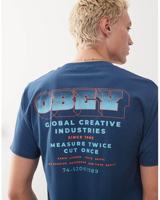 Camiseta Azul Bahía Con Estampado "Measure Twice" En La Espalda De Obey de hombre de color Blue