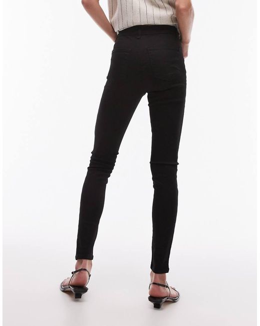 Vaqueros De Corte Superpitillo Y Talle Alto Joni De TOPSHOP de color Black