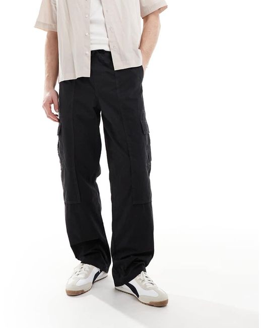 Pantalones Cargo Negros Holgados Sin Cierres De ASOS de hombre de color White