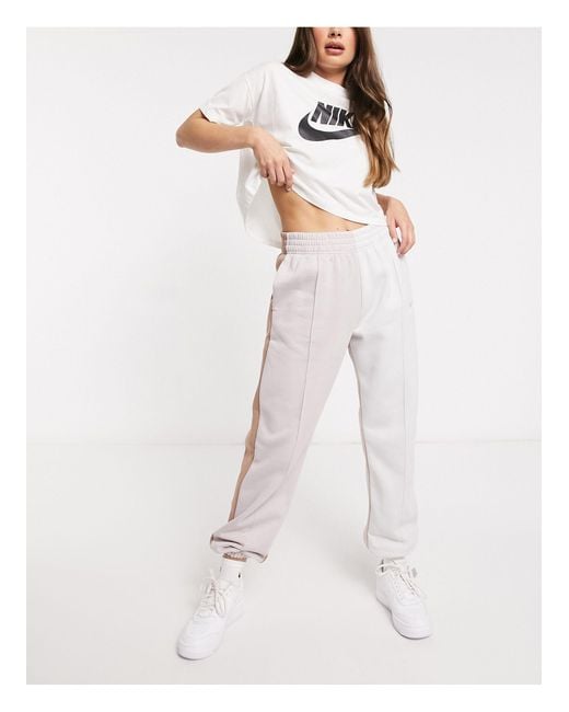 Nike Metallic Swoosh Colour Block joggers Lyst UK