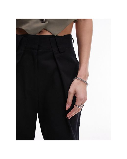 Pantalon large ajusté avec pinces sur l'ourlet TOPSHOP en coloris Black