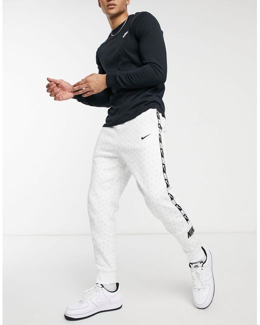 Nike White Repeat Pack All-over Logo Print Taping Cuffed Track Pants for men