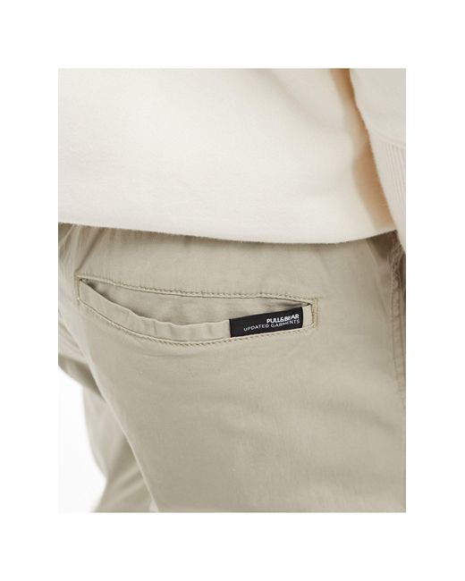 Pantaloni con fondo elasticizzato color sabbia da Uomo di Pull&Bear in  Neutro | Lyst