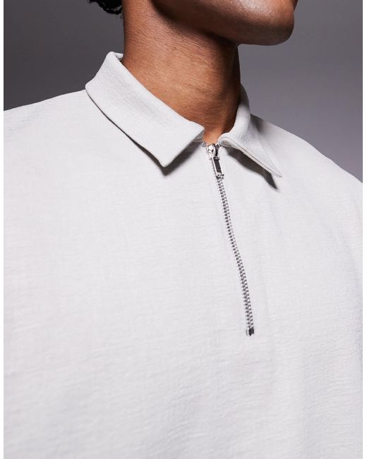 Polo décontracté coupe carrée à col zippé en tissu texturé ASOS pour homme en coloris Blue