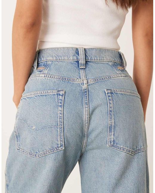 Vaqueros De Campana De Talle Alto Y Corte Holgado Con Lavado Azul Medio Eden De Free People de color Blue