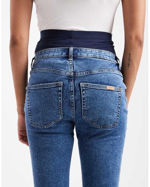 Vaqueros De Corte Pitillo Ultimate De Asos Design Maternity ASOS de color Blue