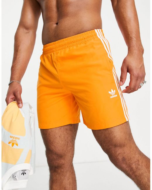 adidas Originals Synthetic Adicolor Three Stripe Swim Shorts in Orange