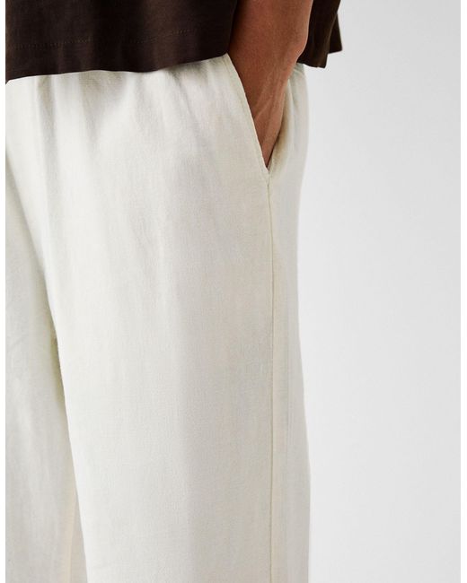 Pantaloni con fondo ampio di Bershka in White da Uomo