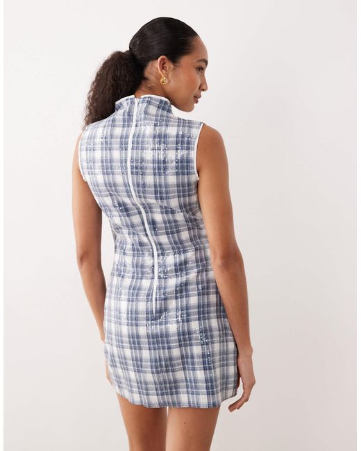 Maya - robe courte et sans manches ornée Ghospell en coloris Blue