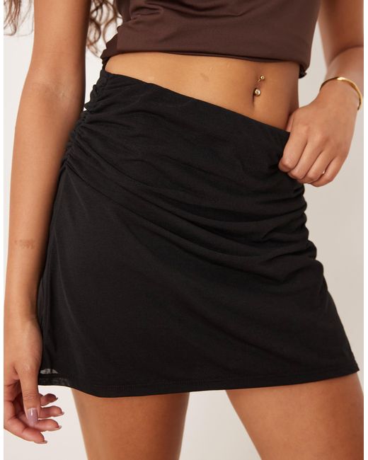 Mini-jupe en tulle à détails froncés ASOS en coloris Black