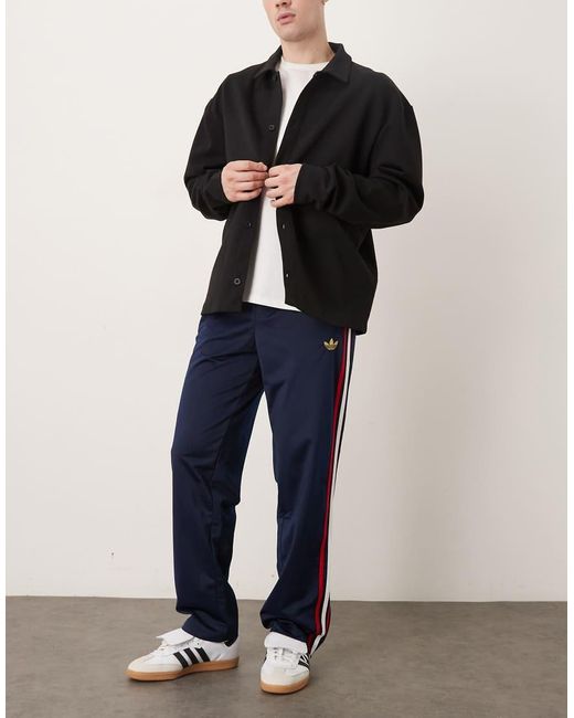 Adidas Originals Blue Firebird Track Pants for men