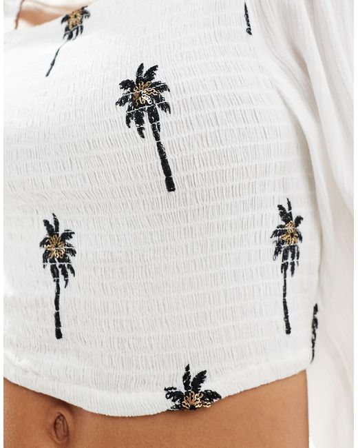 Top smocké à manches longues avec broderies South Beach en coloris White