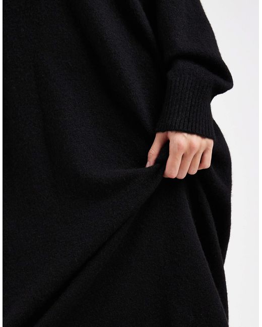 Robe pull mi-longue en maille avec manches longues Monki en coloris Black