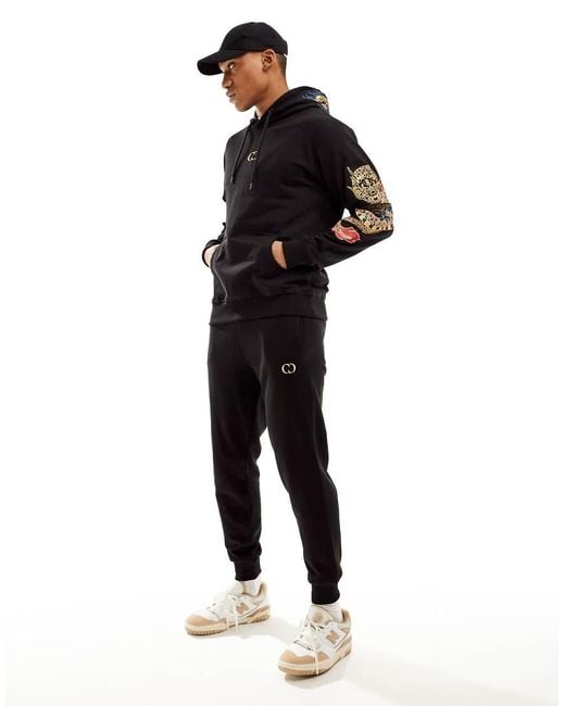 Criminal Damage Dragon Detail Embriodery Joggers in Black for Men Lyst UK