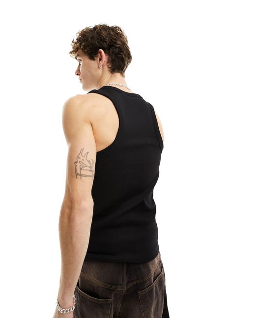 Top senza maniche con etichetta del logo di Calvin Klein in Black da Uomo
