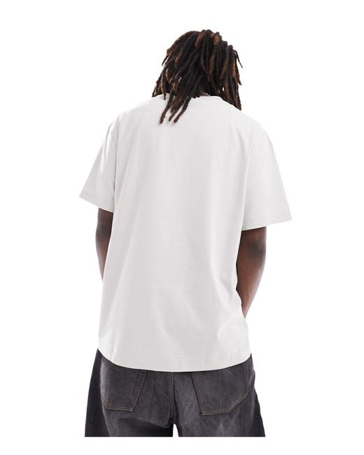 Camiseta extragrande unisex con estampado gráfico exclusiva en asos Weekday de color White