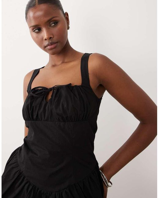 The Frolic Black Exclusive Bengaline Tie Front Detail Skater Mini Dress