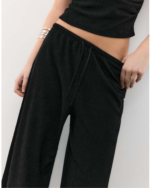 Stradivarius Black Flowing Creased-effect Trousers