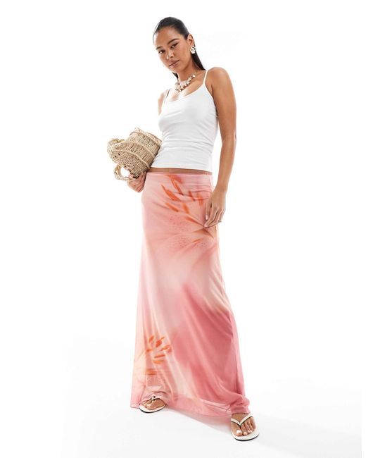 Jupe longue en jersey à imprimé fleurs Stradivarius en coloris Pink