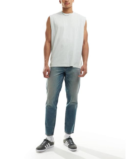Vaqueros Azules De Corte Tapered Con Lavado Claro Y Acabado Tintado De ASOS de hombre de color Blue