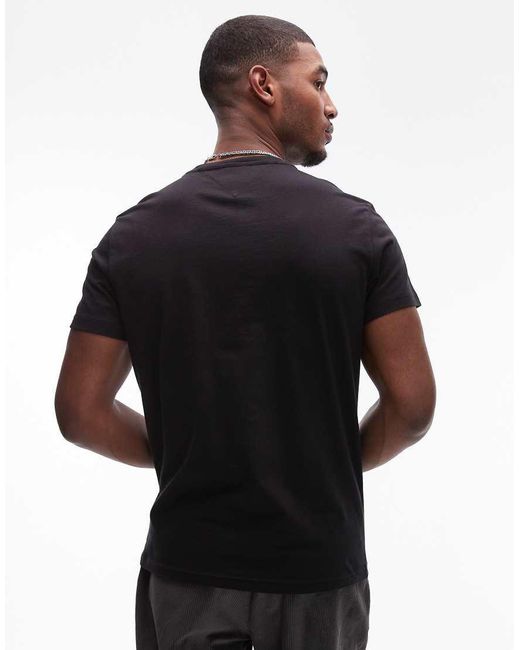 T-Shirt Nera E Verde Con Logo di Tommy Hilfiger in Black da Uomo