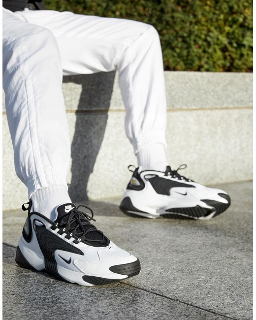 white & black zoom 2k trainers