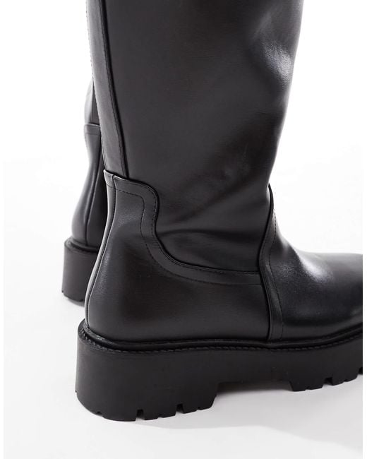 Curve - carmen - bottes plates hauteur genou à semelle chunky ASOS en coloris Black