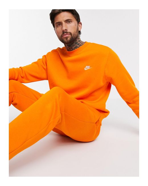 Nike – Club – Rundhals-Sweatshirt in Orange für Herren