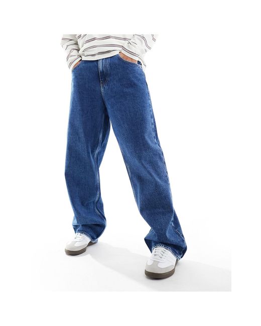 Aiden - jeans larghi lavaggio medio di Tommy Hilfiger in Blue da Uomo