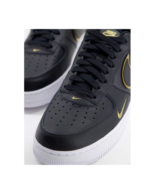 black air force 1 gold tick
