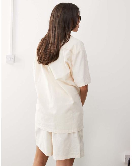 Reclaimed Vintage Natural Unisex Short Sleeve Shirt With Logo And Flower Print